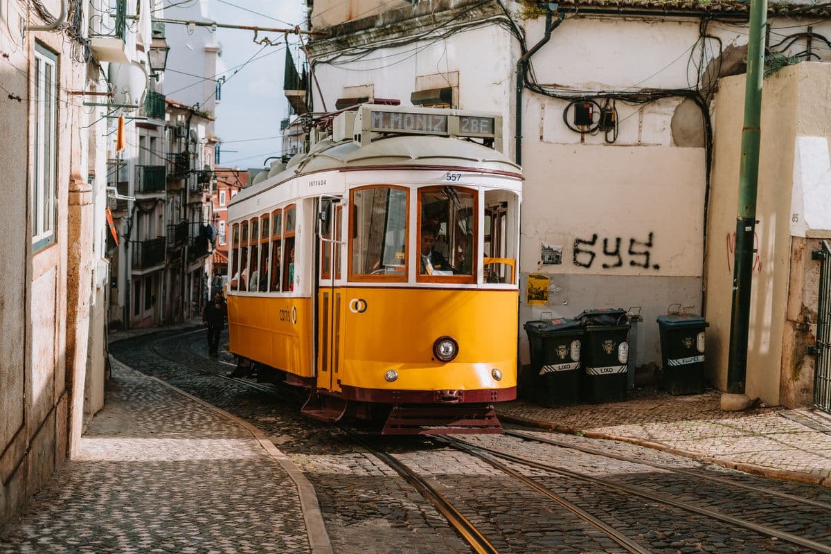 A yellow Lisbon tram, playing docked in the sidebar